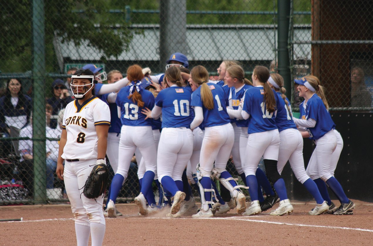 Adna players celebrate a home run from Danika Hallom during a win over Forks on Friday during the 2B state softball tournament in Yakima.